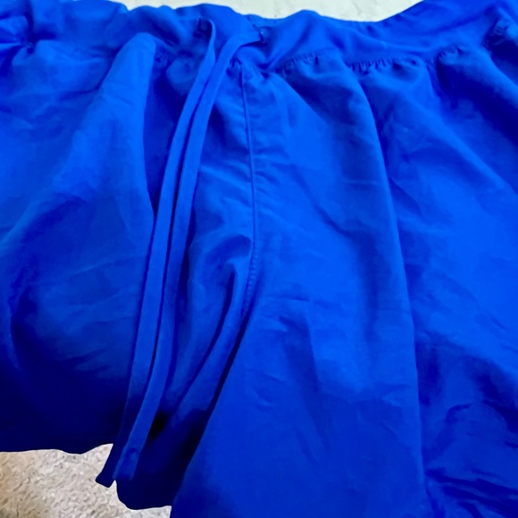 Royal Blue Running Shorts w/Pink Trim. Ladies- size L (has reflective markings) - Picture 10 of 11